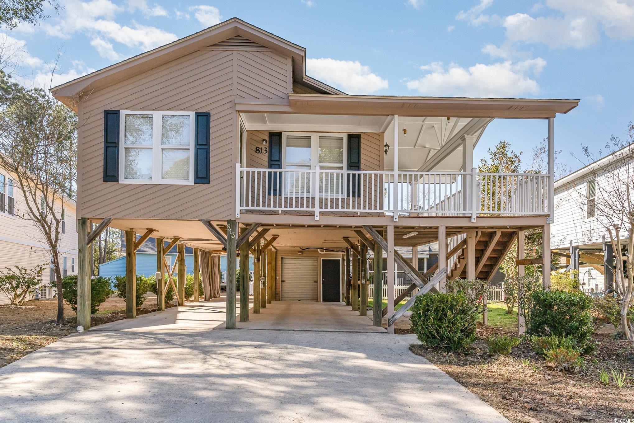 813 Starboard Court Murrells Inlet, SC 29576 - Photo 17 of 17 Coastal inspired home featuring a carport, a porch