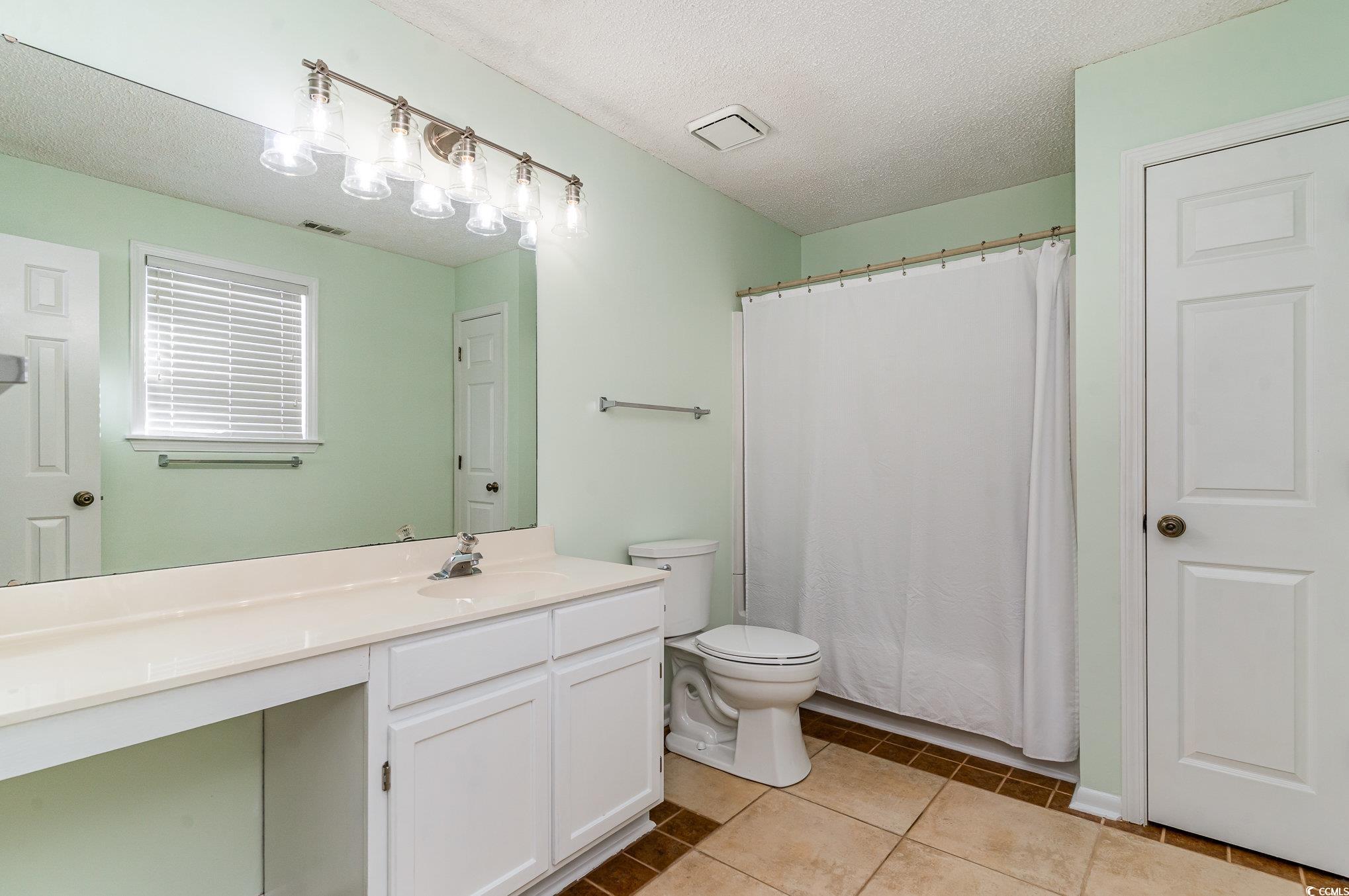 813 Starboard Court Murrells Inlet, SC 29576 - Photo 8 of 17 Bathroom featuring visible vents, toilet, tile pat