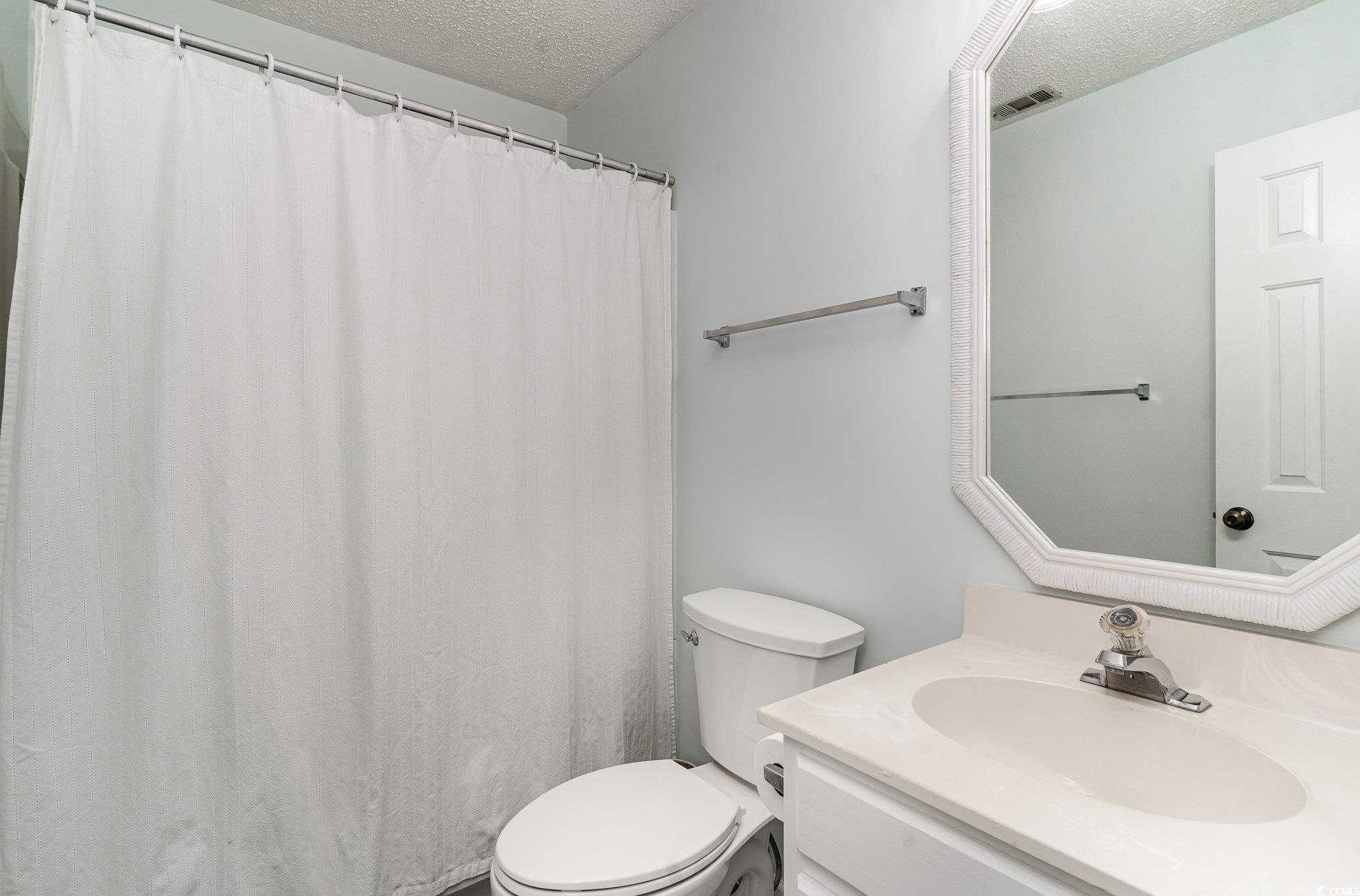 813 Starboard Court Murrells Inlet, SC 29576 - Photo 10 of 17 Full bathroom with visible vents, a textured ceili