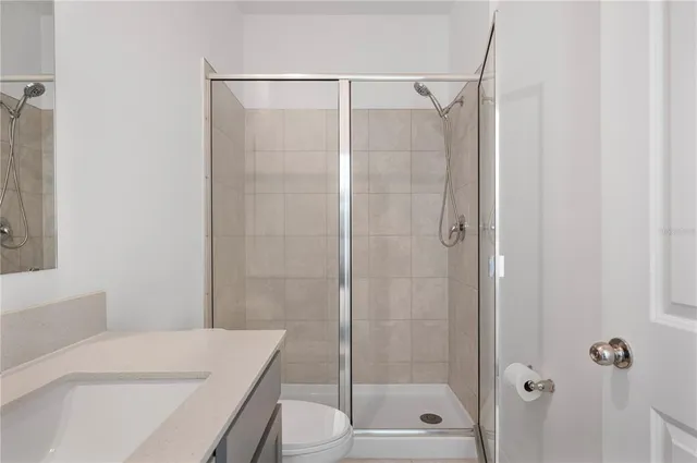 a view of a house with backyard outdoor seating and hardwood floor