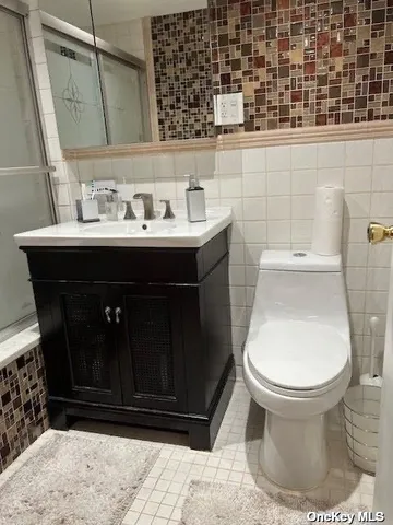 a living room with furniture and a mirror