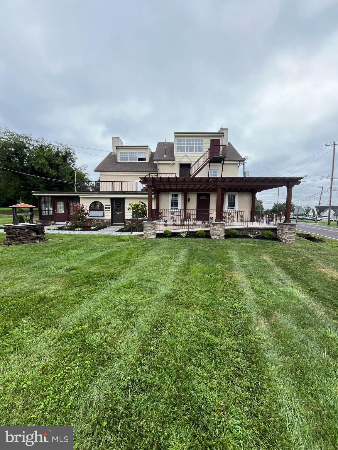 793 Penns Park Road, Unit C Newtown, PA 18940 - Photo 1 of 18 a view of a house with a big yard and large trees