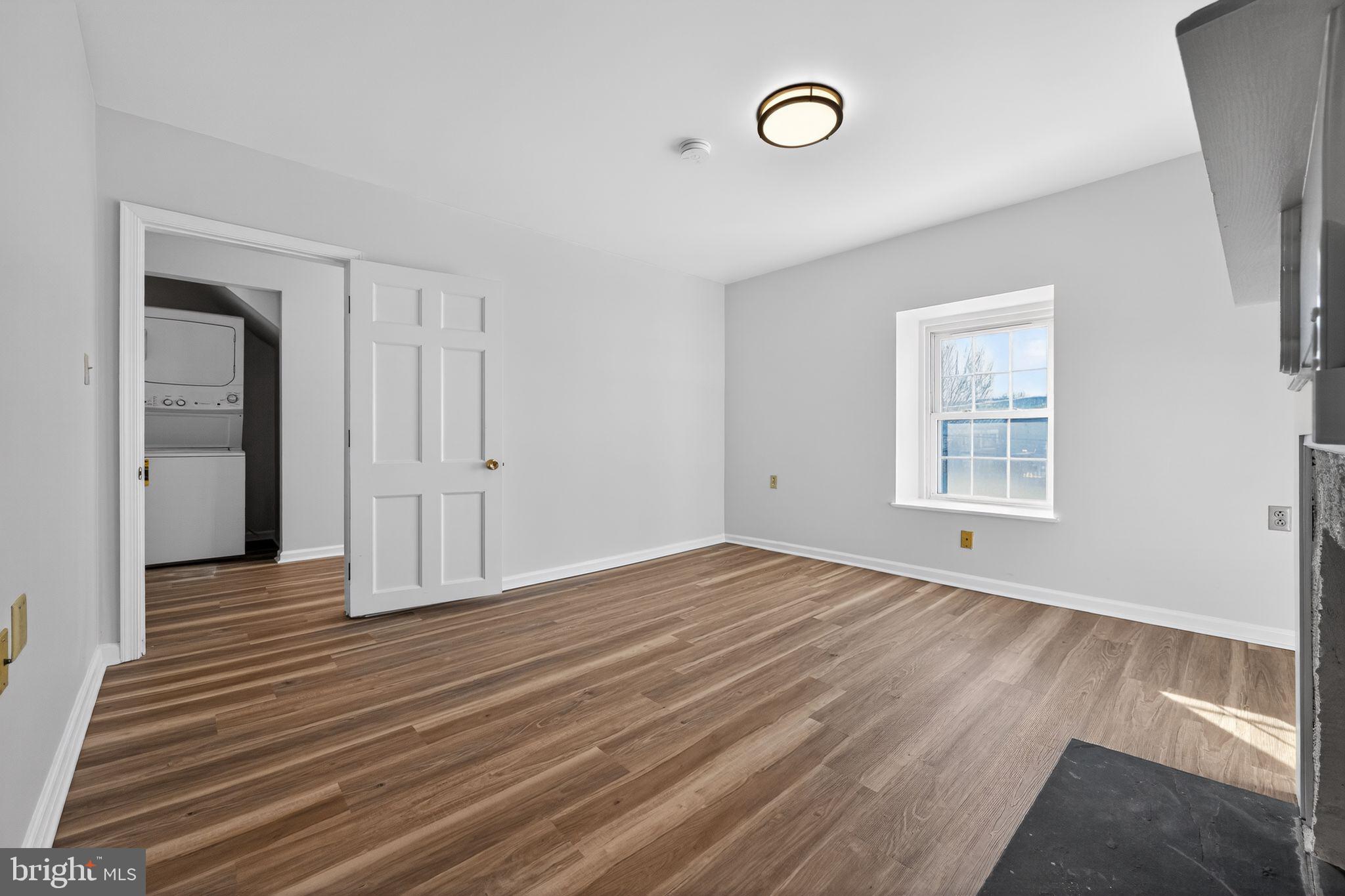 793 Penns Park Road, Unit C Newtown, PA 18940 - Photo 12 of 18 a view of empty room with wooden floor and fan