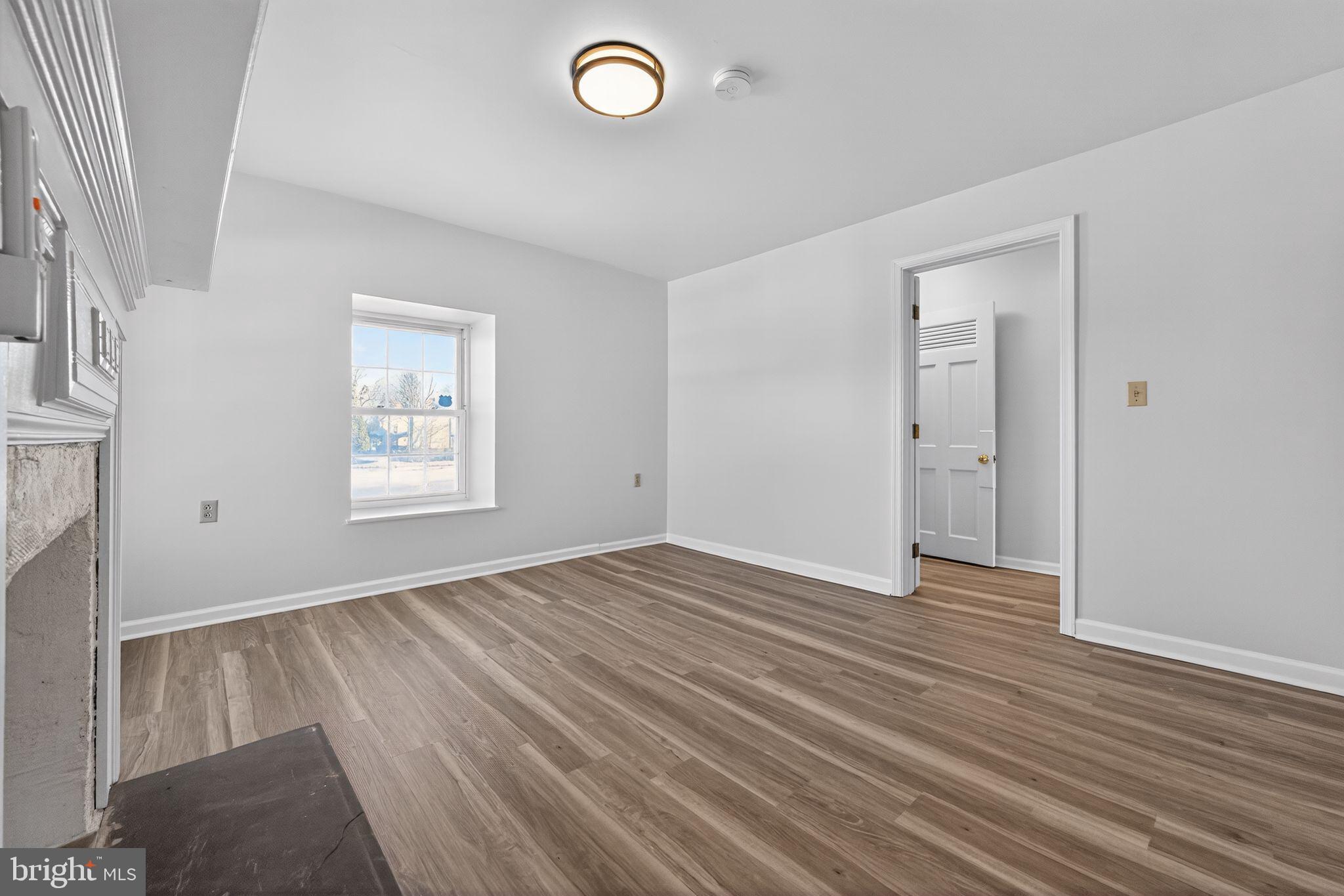 793 Penns Park Road, Unit C Newtown, PA 18940 - Photo 15 of 18 an empty room with wooden floor and windows