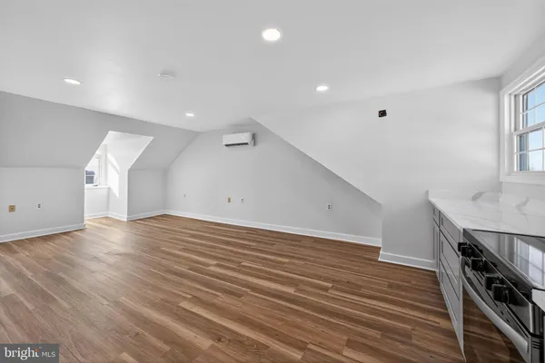 a view of a room with wooden floor and stairs