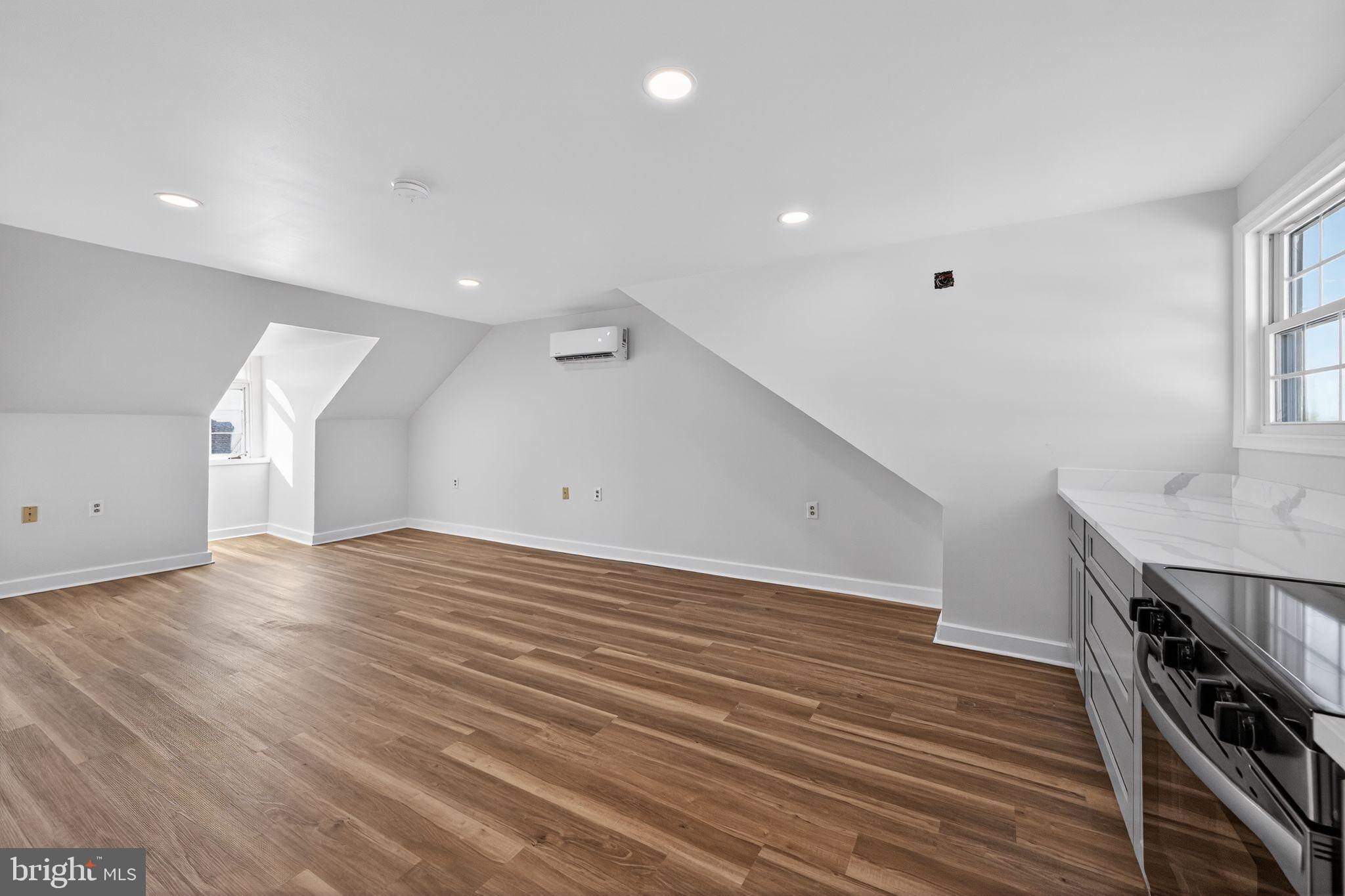 793 Penns Park Road, Unit C Newtown, PA 18940 - Photo 7 of 18 a view of a room with wooden floor and stairs
