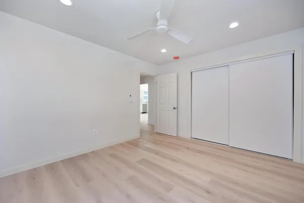 a view of an empty room with a window