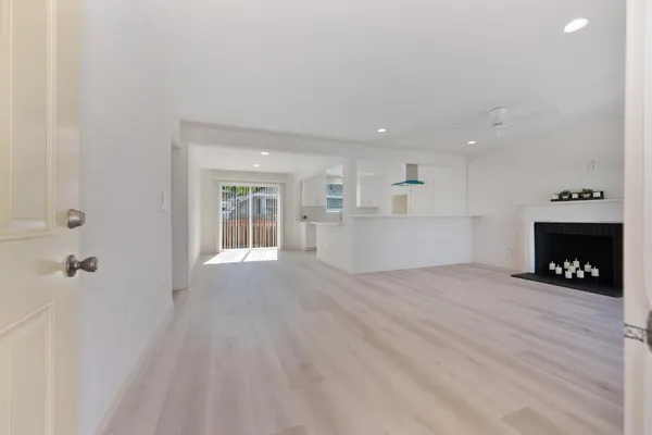 a view of an empty room with a window