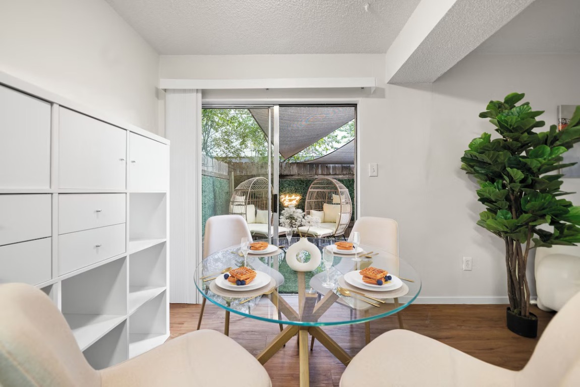 3507 Alpine Circle Austin, TX 78704 - Photo 10 of 39 a dining room with furniture potted plants and wooden floor