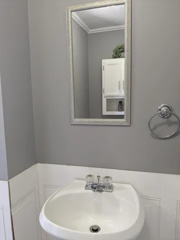 a bathroom with a sink and a window