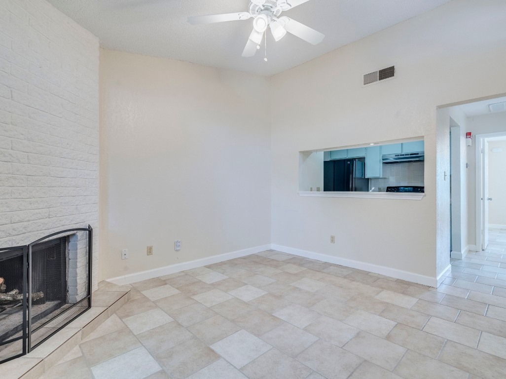 3815 Menchaca Road, Unit 19 Austin, TX 78704 - Photo 4 of 14 wooden floor in an empty room with a fireplace