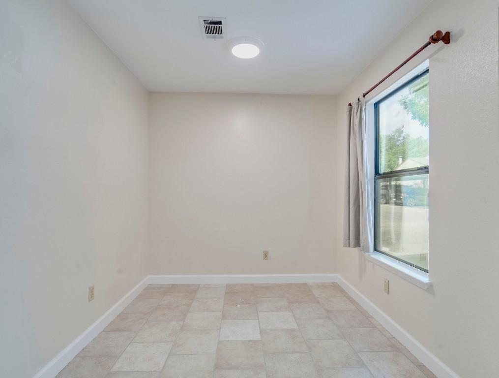 3815 Menchaca Road, Unit 19 Austin, TX 78704 - Photo 8 of 14 a view of an empty room with a window