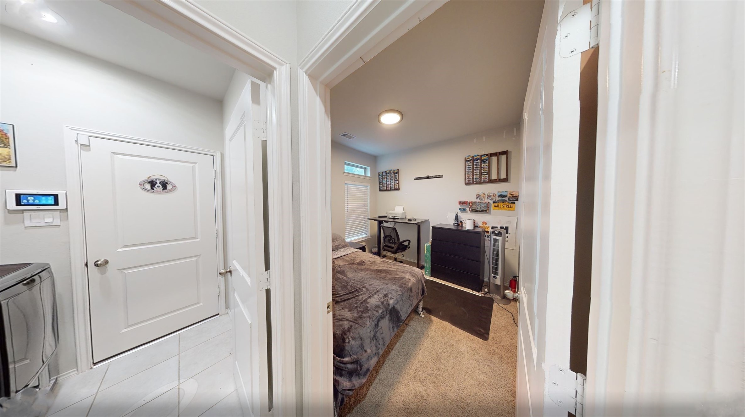718 Santa Elena Trail Conroe, TX 77304 - Photo 20 of 29 Discover a cozy third bedroom that offers a perfect blend of comfort and functionality, ideal for personal retreats or productive office space.