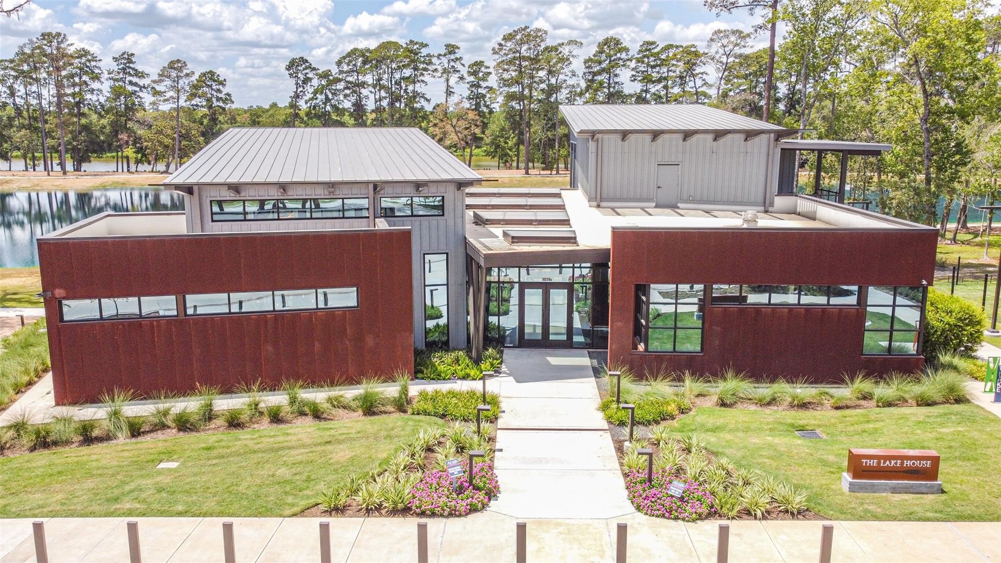 718 Santa Elena Trail Conroe, TX 77304 - Photo 24 of 29 Discover the perfect blend of modern design and natural beauty at this stunning lakeside retreat, offering exclusive amenities in a serene, picturesque setting.