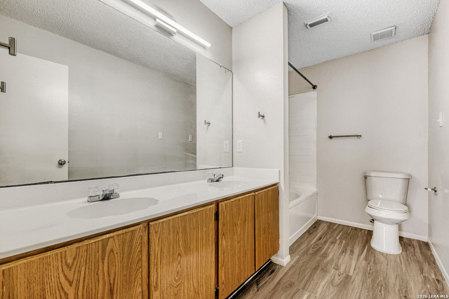 8264 Longhorn Ridge Drive Converse, TX 78109 - Photo 14 of 17 a bathroom with a sink and a mirror