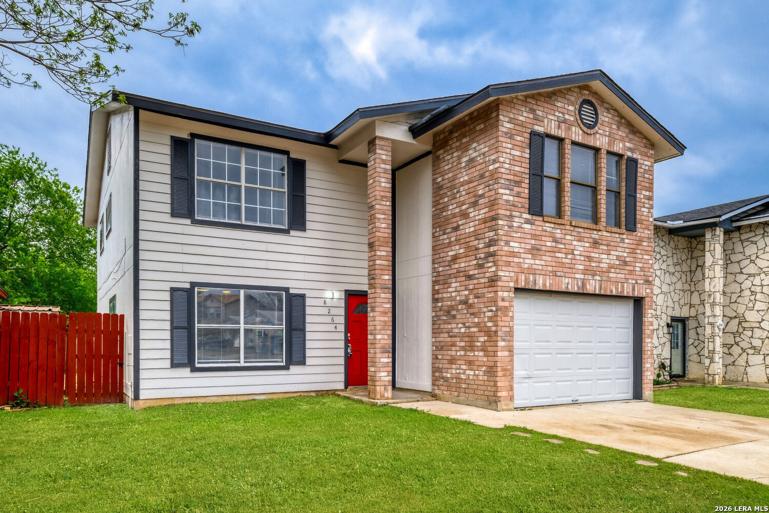 8264 Longhorn Ridge Drive Converse, TX 78109 - Photo 2 of 17 a front view of a house with a garden