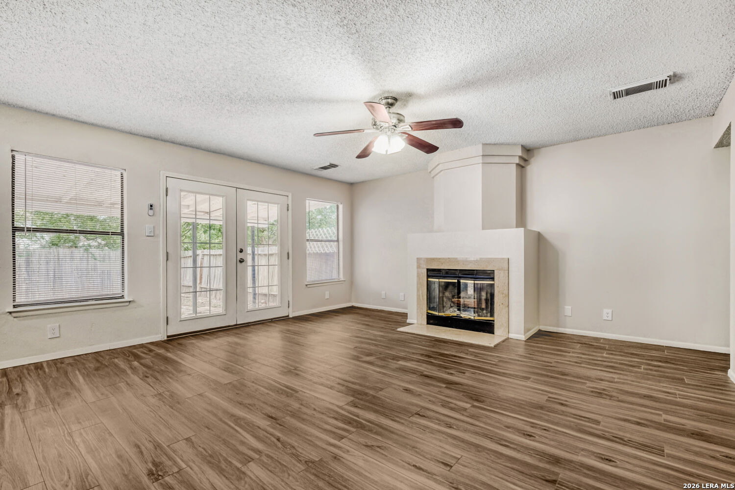 8264 Longhorn Ridge Drive Converse, TX 78109 - Photo 4 of 17 a view of an empty room with a fireplace and a window