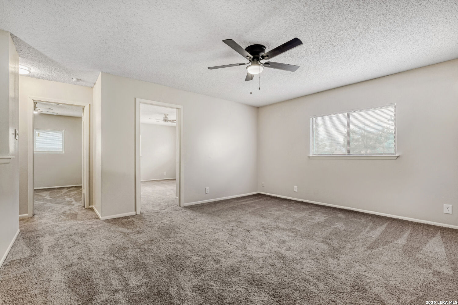 8264 Longhorn Ridge Drive Converse, TX 78109 - Photo 7 of 17 an empty room with a empty space and windows