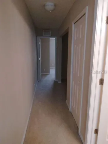 a view of room with racks on the wall