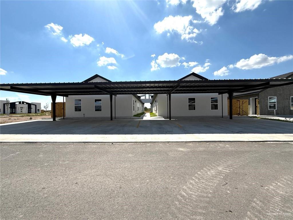 11308 North 25th Street, Unit 4 McAllen, TX 78504 - Photo 12 of 14 a black and white building with a outdoor space