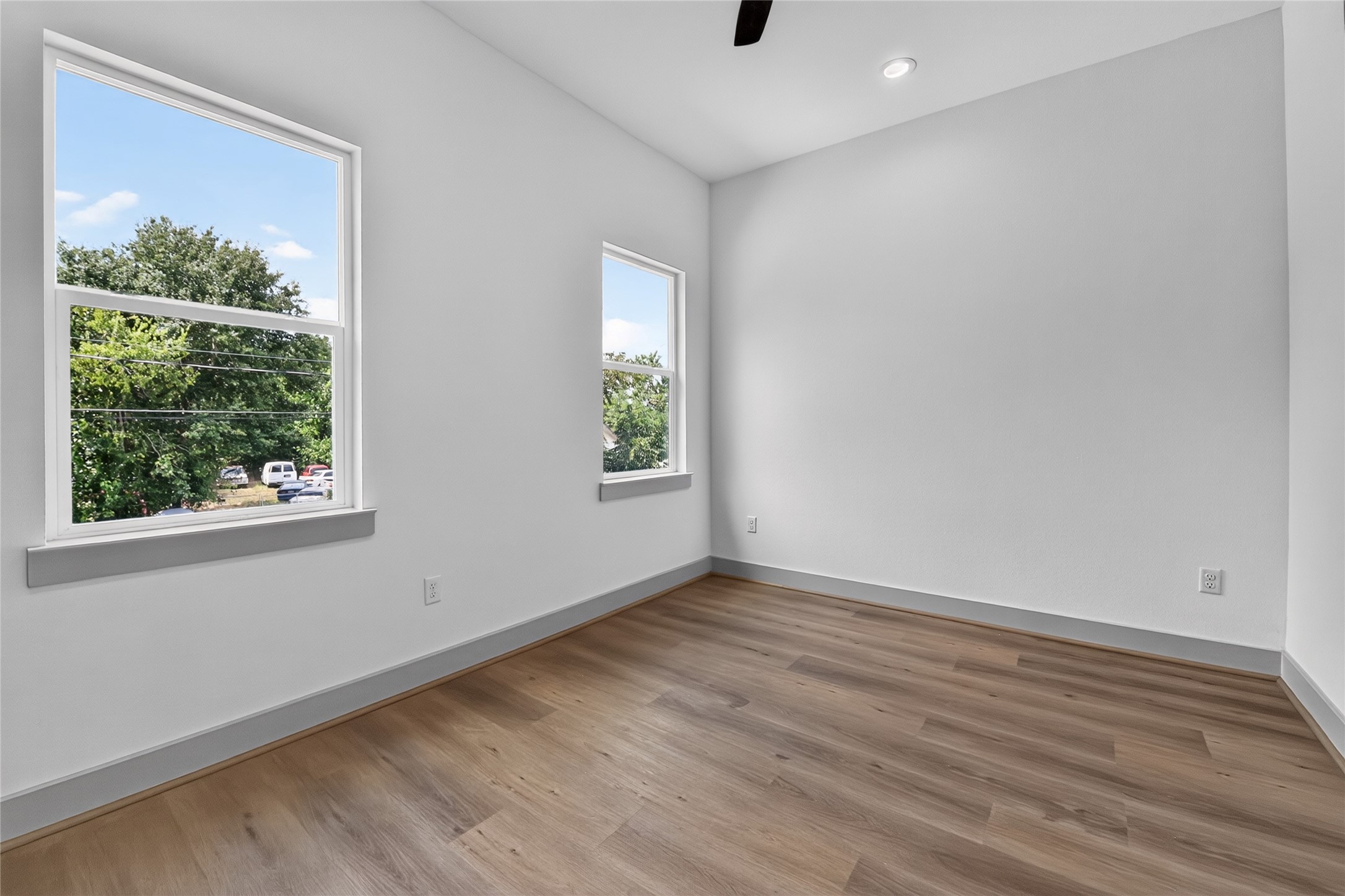 6815 Stearns Street Houston, TX 77021 - Photo 27 of 35 Featuring two expansive windows, this secondary bedroom maximizes light and space effortlessly.