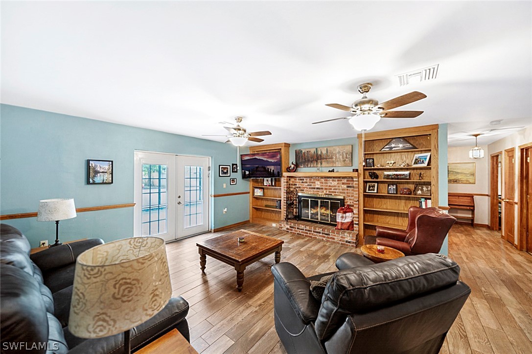 10244 Horizon Drive Spring Hill, FL 34608 - Photo 14 of 35 a living room with furniture and wooden floor