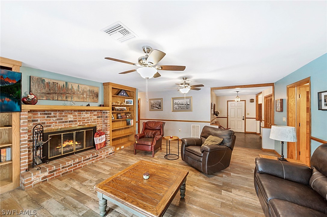 10244 Horizon Drive Spring Hill, FL 34608 - Photo 16 of 35 a living room with furniture fireplace and flat screen tv