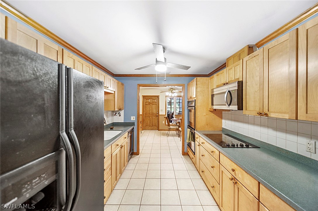 10244 Horizon Drive Spring Hill, FL 34608 - Photo 18 of 35 a hallway with white cabinets and wooden floor