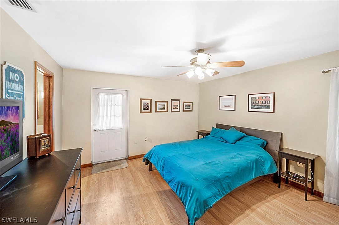 10244 Horizon Drive Spring Hill, FL 34608 - Photo 20 of 35 a bedroom with a bed and a window