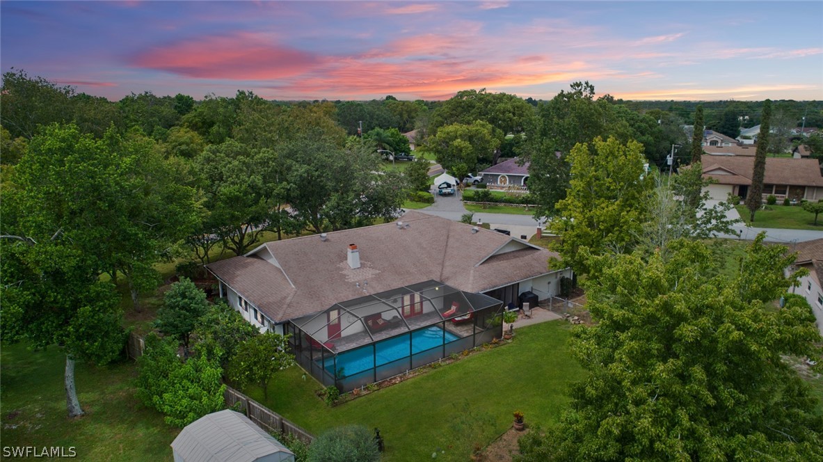 10244 Horizon Drive Spring Hill, FL 34608 - Photo 2 of 35 an aerial view of a house with pool outdoor seating and yard