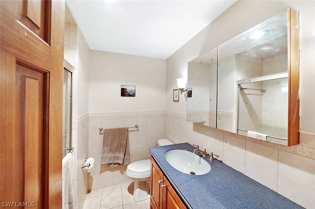 10244 Horizon Drive Spring Hill, FL 34608 - Photo 22 of 35 a bathroom with a granite countertop sink and a mirror