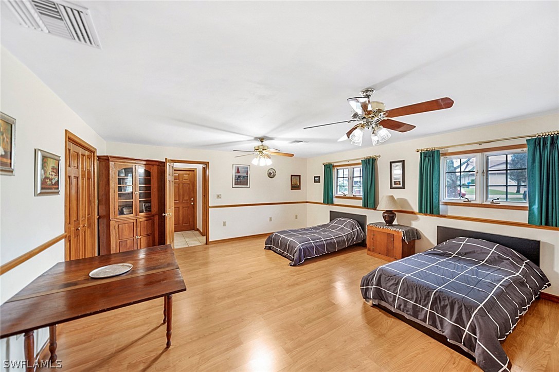 10244 Horizon Drive Spring Hill, FL 34608 - Photo 27 of 35 a spacious bedroom with a bed window and dresser