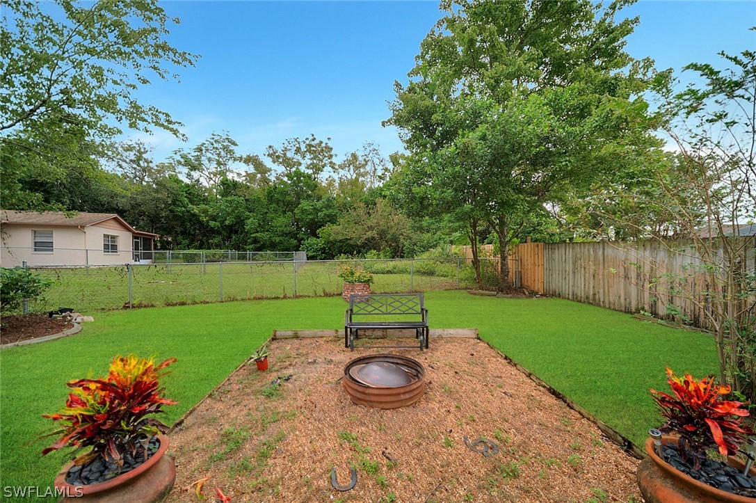 10244 Horizon Drive Spring Hill, FL 34608 - Photo 33 of 35 a view of a park with large trees and a wooden fence