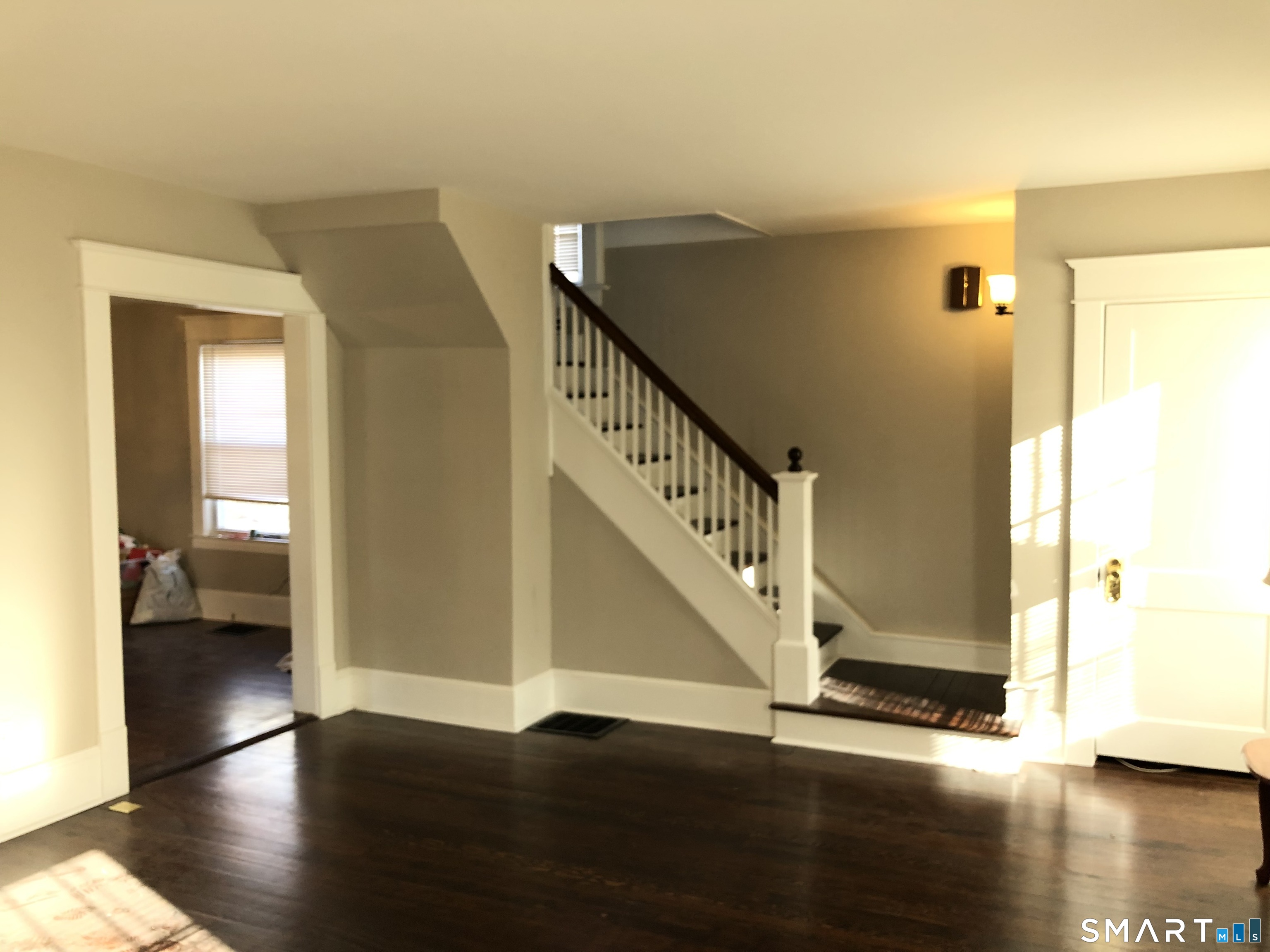 16 Cowing Terrace Stamford, CT 06906 - Photo 22 of 24 a view of a hallway with wooden floor and stairs