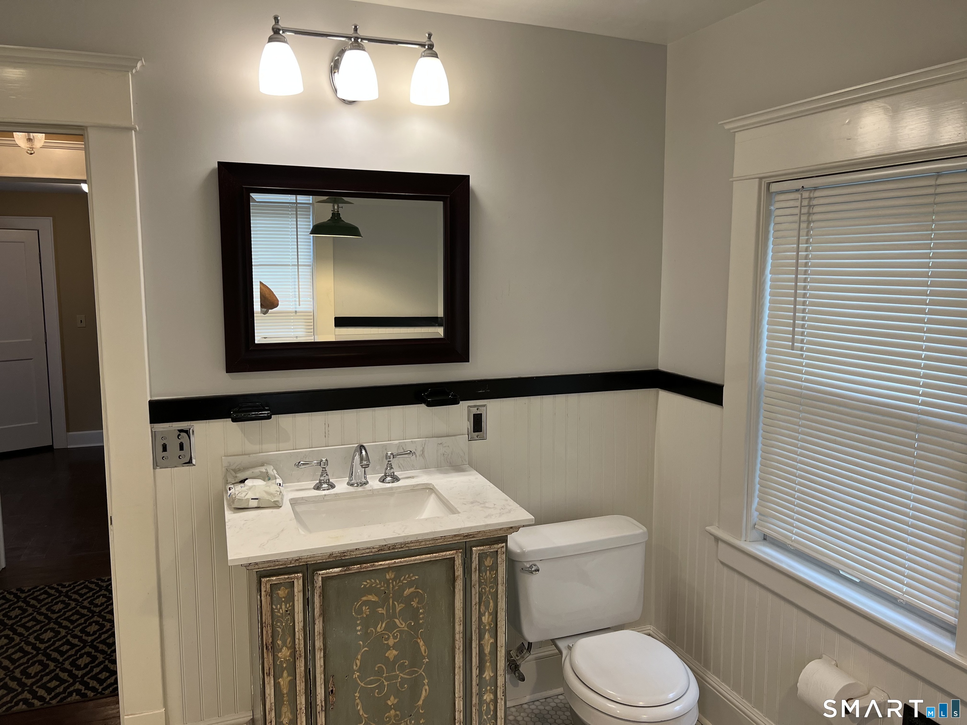 16 Cowing Terrace Stamford, CT 06906 - Photo 4 of 24 a bathroom with a toilet sink and mirror