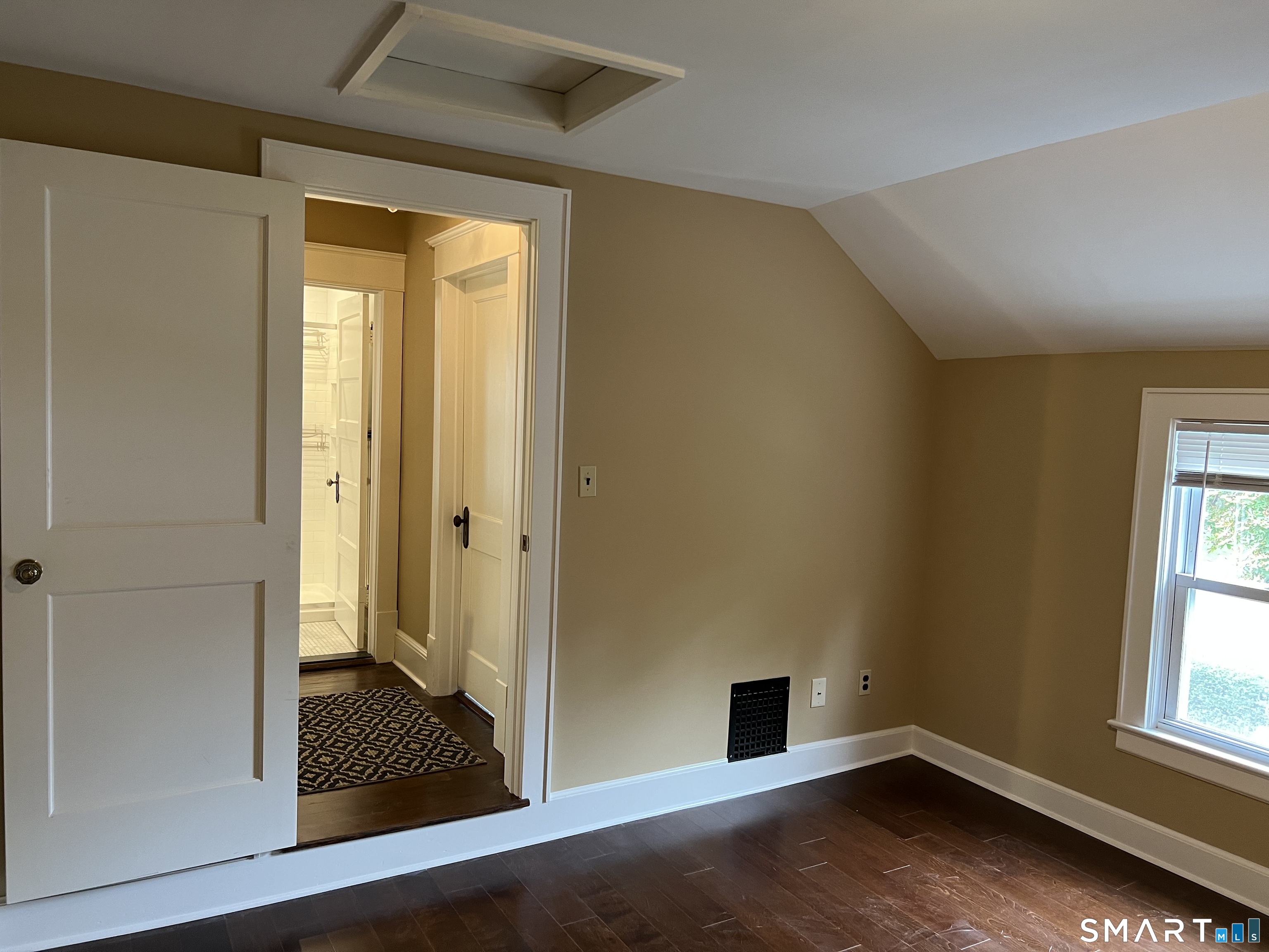 16 Cowing Terrace Stamford, CT 06906 - Photo 6 of 24 an empty room with wooden floor and windows