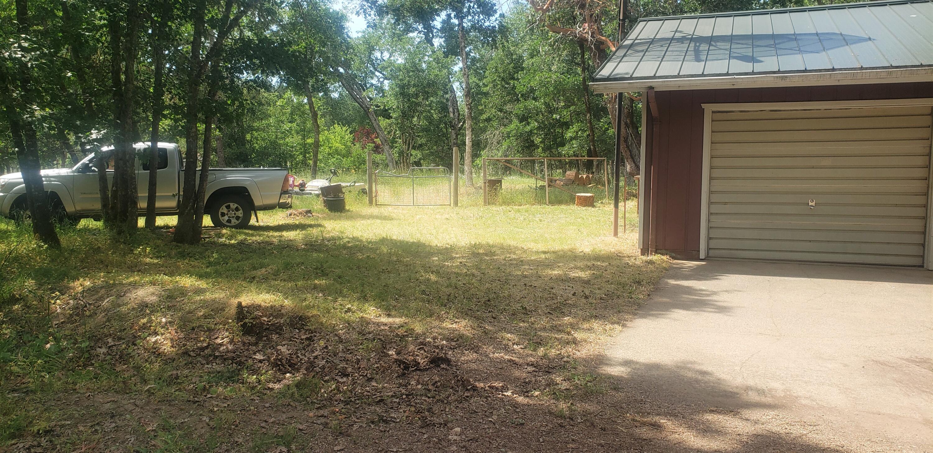1424 Dick George Road Cave Junction, OR 97523 - Photo 4 of 22 single car garage attached to home