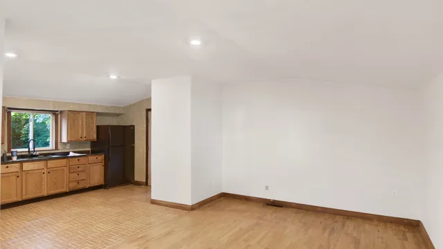 a view of a kitchen with a sink dishwasher and a refrigerator