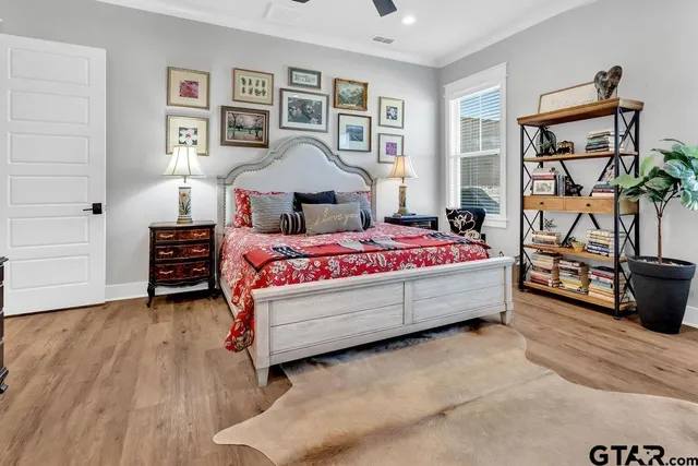 a spacious bathroom with a double vanity sink a mirror and a bathtub