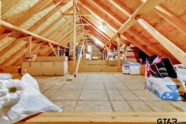 an aerial view of a house with a swimming pool