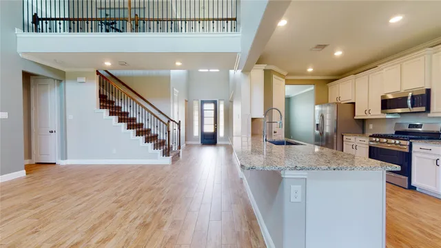 a view of kitchen with wooden floor