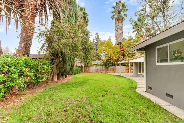 a backyard of a house with lots of green space