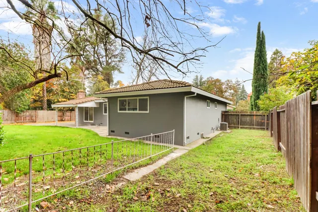 a backyard of a house with lots of green space