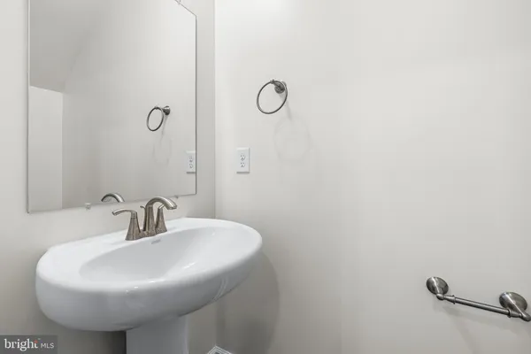 a bathroom with a sink and mirror