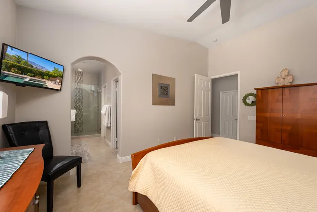 a bathroom with a double vanity sink mirror and shower