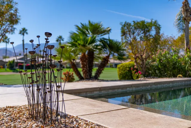 a view of pool with outdoor seating