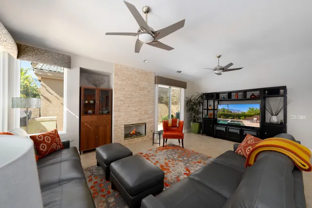 a view of a dining room with furniture and a potted plant