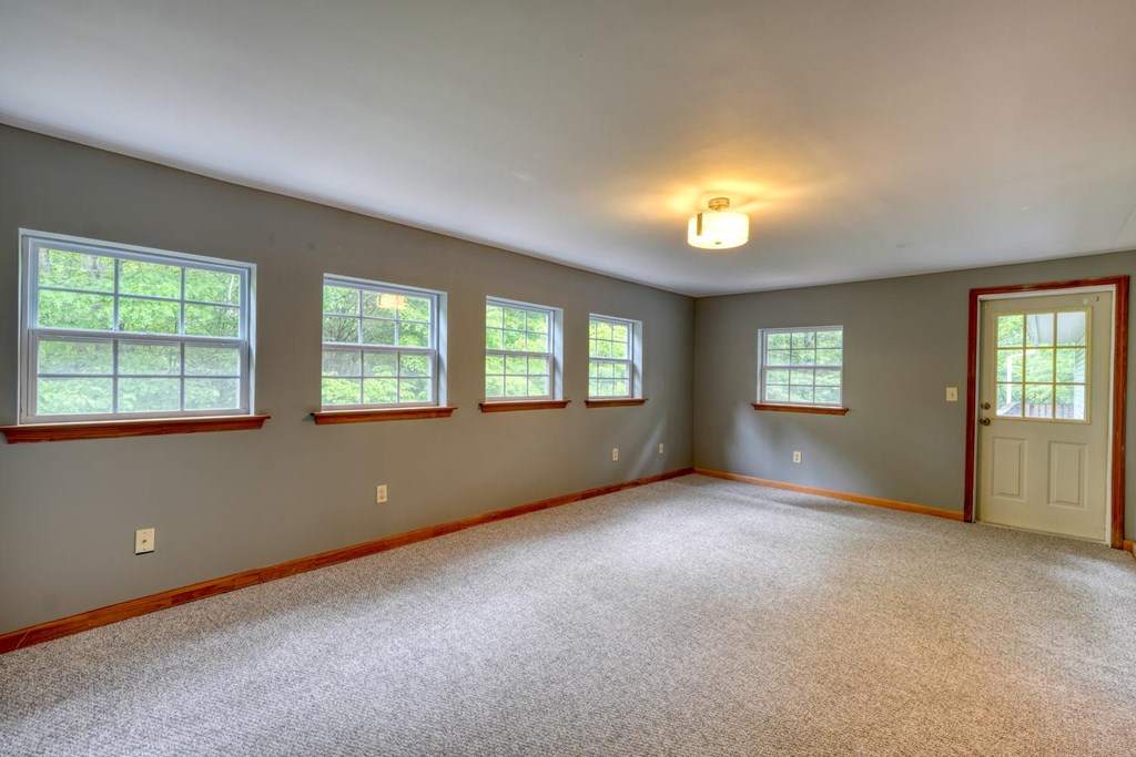 1066 Ridge Road Hiawassee, GA 30546 - Photo 24 of 51 an empty room with windows and closet