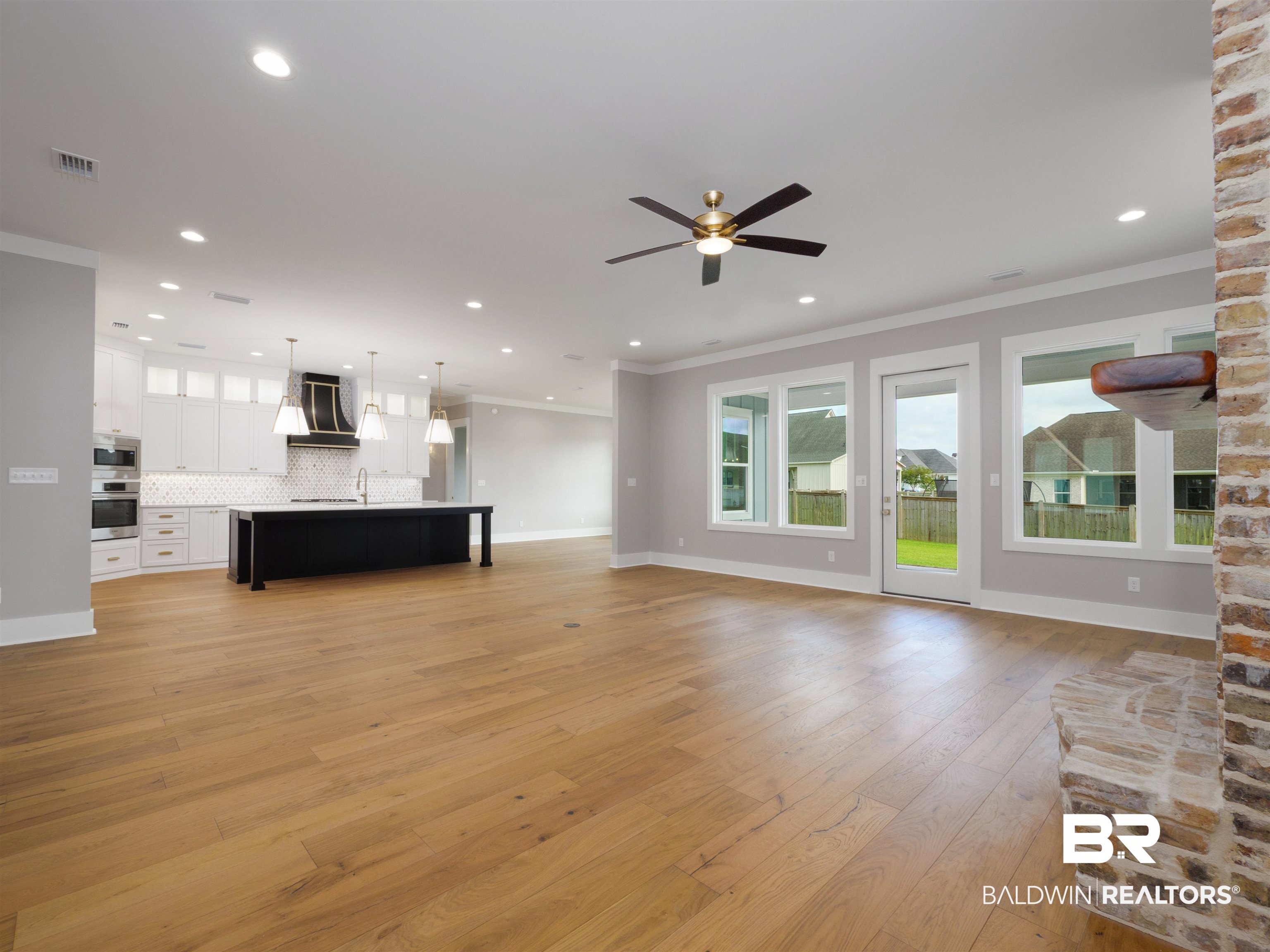 10912 Catania Avenue Fairhope, AL 36532 - Photo 11 of 54 The view of the living room looking towards the kitchen area