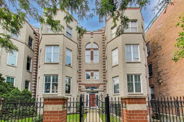 front view of a brick house with a large windows